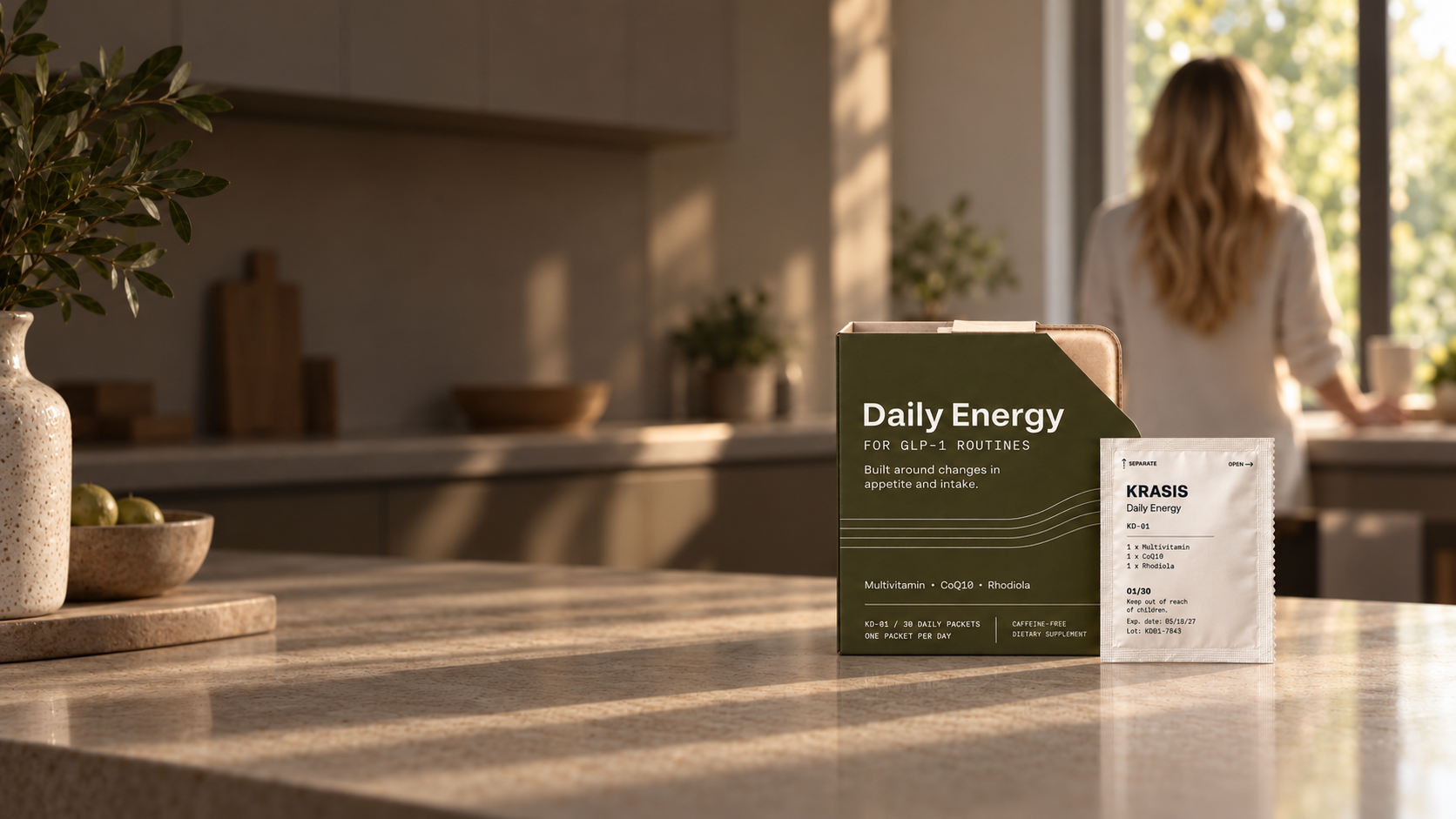 Krasis Daily Energy box and daily packet in a sunlit kitchen